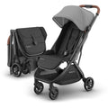 UPPAbaby Minu V3 lightweight travel stroller in Greyson color, compact design, one-hand fold, with charcoal frame and saddle leather accents.