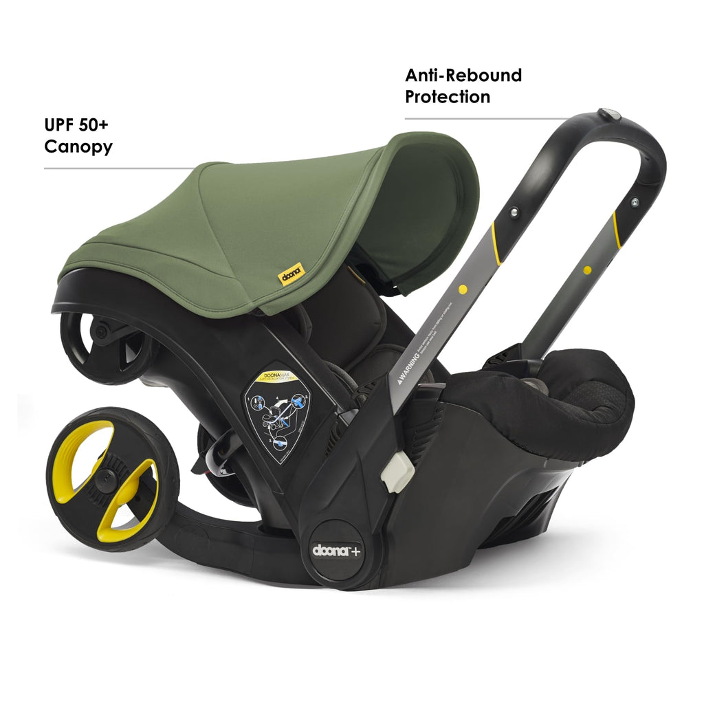 Doona all-in-one travel system with slate green car seat and stroller, featuring adjustable handlebars and safety harness.